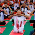Indian Prime Minister Narendra Modi performs yoga on International Yoga Day in Lucknow