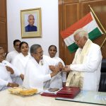 1 Rajyogini B K Ambika Behenji tying Rakhi to Shri Vajubhai Rudabhai Vala, Hon’ble Governor of Karnataka