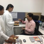 Mr Udai Sinha, Editorial Head, Amar Ujala picking up godly blessiing card after tied Rakhi by B Ks Delhi Hari Nagar