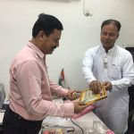 Mr Udai Sinha, Editorial Head, Amar Ujala receiving godly gift after tied Rakhi by B Ks Delhi Hari Nagar